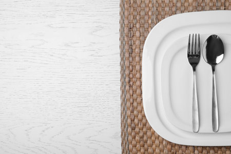 Stylish elegant table setting on wooden background, top view. Space for textの写真素材