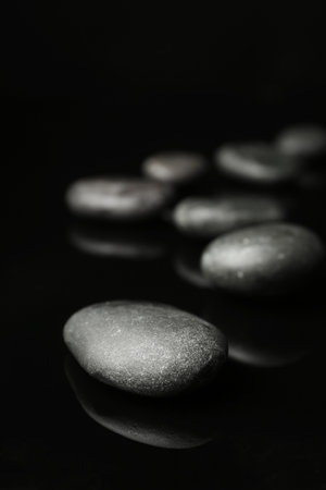 Spa stones on black background. Space for textの写真素材