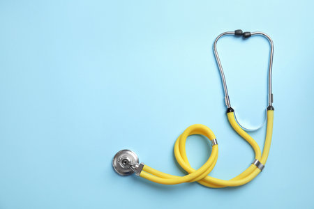 Stethoscope with space for text on color background, top view. medical toolの写真素材