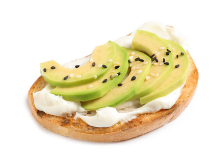 Tasty bruschetta with avocado and sesame seeds on white backgroundの写真素材