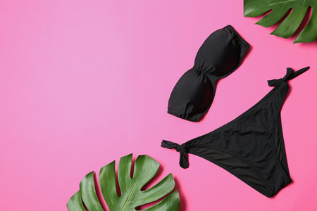 Flat lay composition with stylish bikini on color background. Space for textの写真素材
