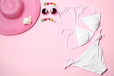 Flat lay composition with stylish bikini on color background. Space for textの写真素材