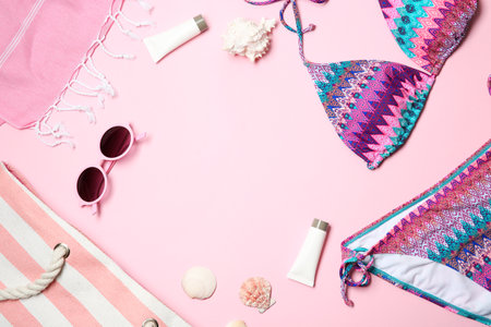 Flat lay composition with stylish bikini on color background. Space for textの写真素材