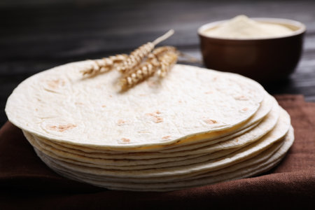 Stack of tasty tortillas on fabric, closeupの写真素材