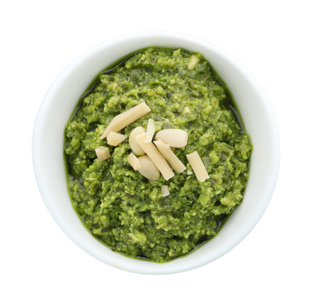Bowl of tasty pesto sauce isolated on white, top viewの写真素材