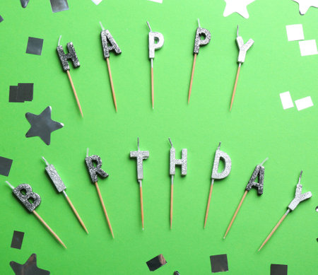 Flat lay composition with birthday candles on color backgroundの写真素材