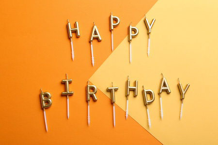Flat lay composition with birthday candles on color backgroundの写真素材