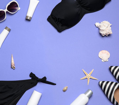 Flat lay composition with stylish bikini on color background. Space for textの写真素材
