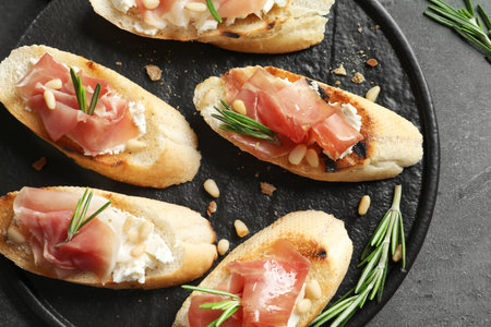 Flat lay composition with tasty bruschettas on gray tableの写真素材
