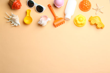 Flat lay composition with bright beach toys on color background. Space for textの写真素材