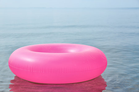 Bright inflatable ring floating on sea water. summer holidaysの写真素材
