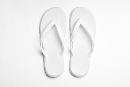 Pair of flip flops on white background, top view. beach accessoriesの写真素材