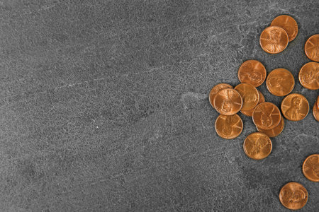 Many coins on color background, top view. Space for textの写真素材