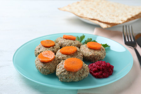 Plate of traditional Passover (Pesach) gefilte fish on wooden tableの写真素材