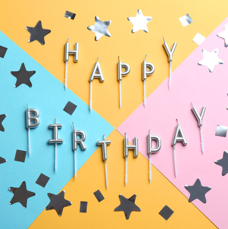 Flat lay composition with birthday candles on color backgroundの写真素材