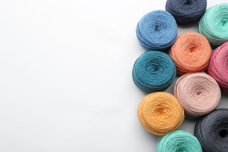 Clews of colorful knitting cotton on white background, top viewの写真素材