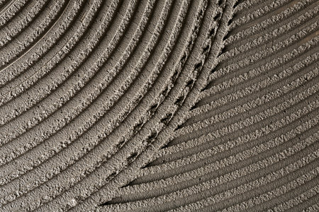 Lined gray concrete as background, top view. Tile installationの写真素材