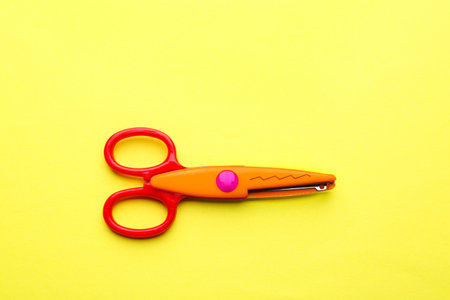 Decorative edge scissors on color background, top viewの写真素材