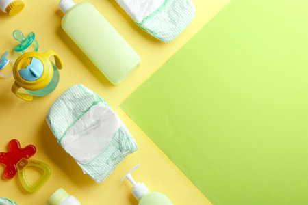 Flat lay composition with baby accessories and space for text on color backgroundの写真素材