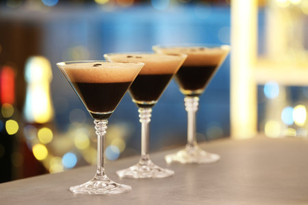 Glasses of delicious Espresso Martini on bar counter. alcohol cocktailの写真素材