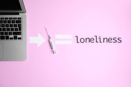 Flat lay composition with laptop, syringe and word LONELINESS on color backgroundの写真素材