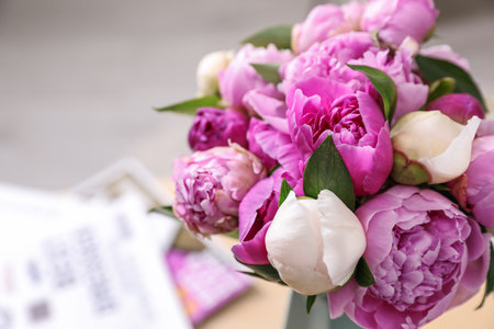 Bouquet of beautiful peonies on blurred background, closeup. Space for textの写真素材