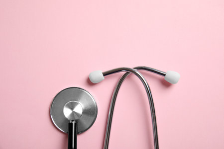 Stethoscope with space for text on color background, top view. medical toolの写真素材