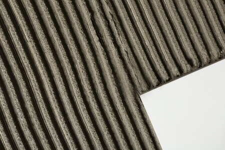 Adhesive mix and ceramic tiles, top view. Space for textの写真素材