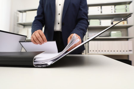 Woman working with documents at table in office, closeupの写真素材