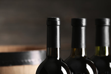 Bottles of tasty wine on dark background, closeupの写真素材