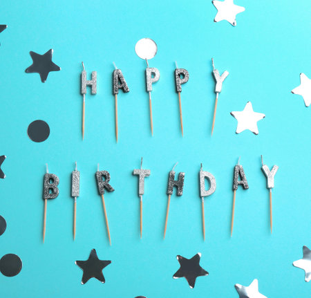 Flat lay composition with birthday candles on color backgroundの写真素材