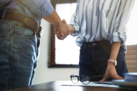 Business partners shaking hands after meeting, closeupの写真素材