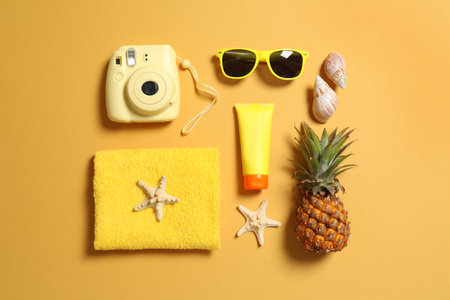 Flat lay composition with beach accessories on color backgroundの写真素材