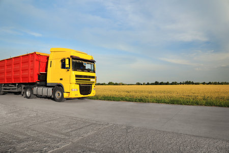 Modern truck on country road. Space for textの写真素材