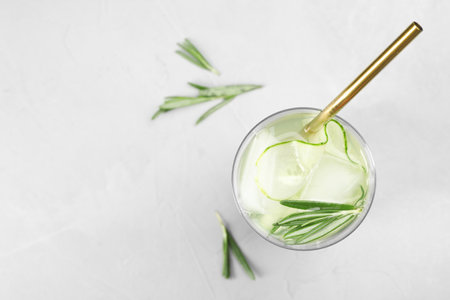 Glass of refreshing cucumber lemonade on table, top view with space for text. summer drinkの写真素材