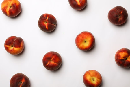 Flat lay composition with sweet juicy peaches on light backgroundの写真素材