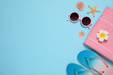 Flat lay composition with beach accessories on color background, space for textの写真素材