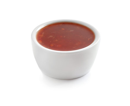 Delicious tomato sauce in bowl on white backgroundの写真素材