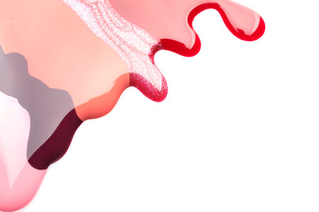 Colorful nail polishes spilled on white backgroundの写真素材