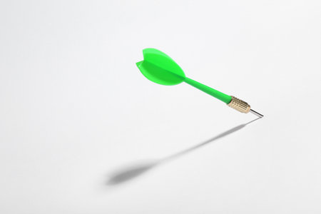 Green dart arrow for game on white backgroundの写真素材