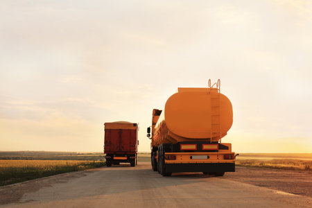 Modern bright trucks parked on country roadの写真素材