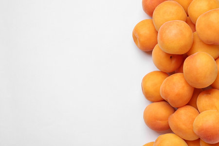 Delicious ripe sweet apricots on white background, top viewの写真素材
