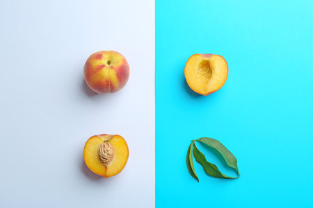 Flat lay composition with fresh peaches on color backgroundの写真素材