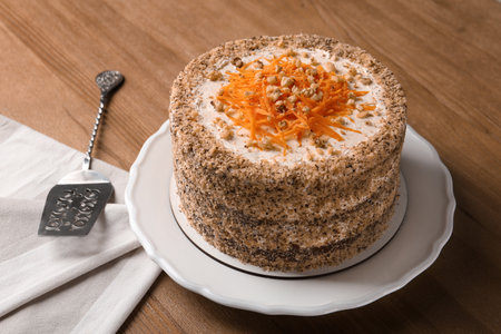 Sweet carrot cake with delicious cream on wooden tableの写真素材