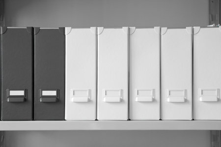 Folders with documents on shelf in archiveの写真素材