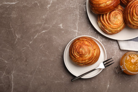 Flat lay composition with buns and space for text on stone background. fresh from ovenの写真素材