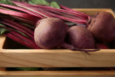 Wooden crate with fresh organic beets, closeupの写真素材