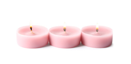 Pink wax decorative candles isolated on whiteの写真素材