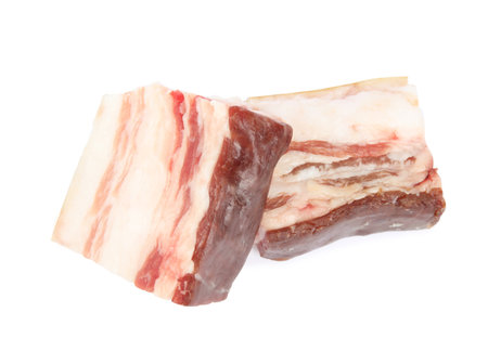 Pieces of tasty bacon isolated on whiteの写真素材