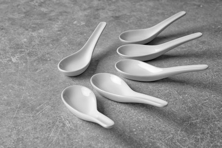 Clean Miso soup spoons on gray backgroundの写真素材